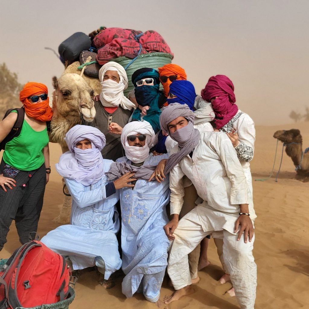 Camel trekking during spiritual yoga retreat in Sahara